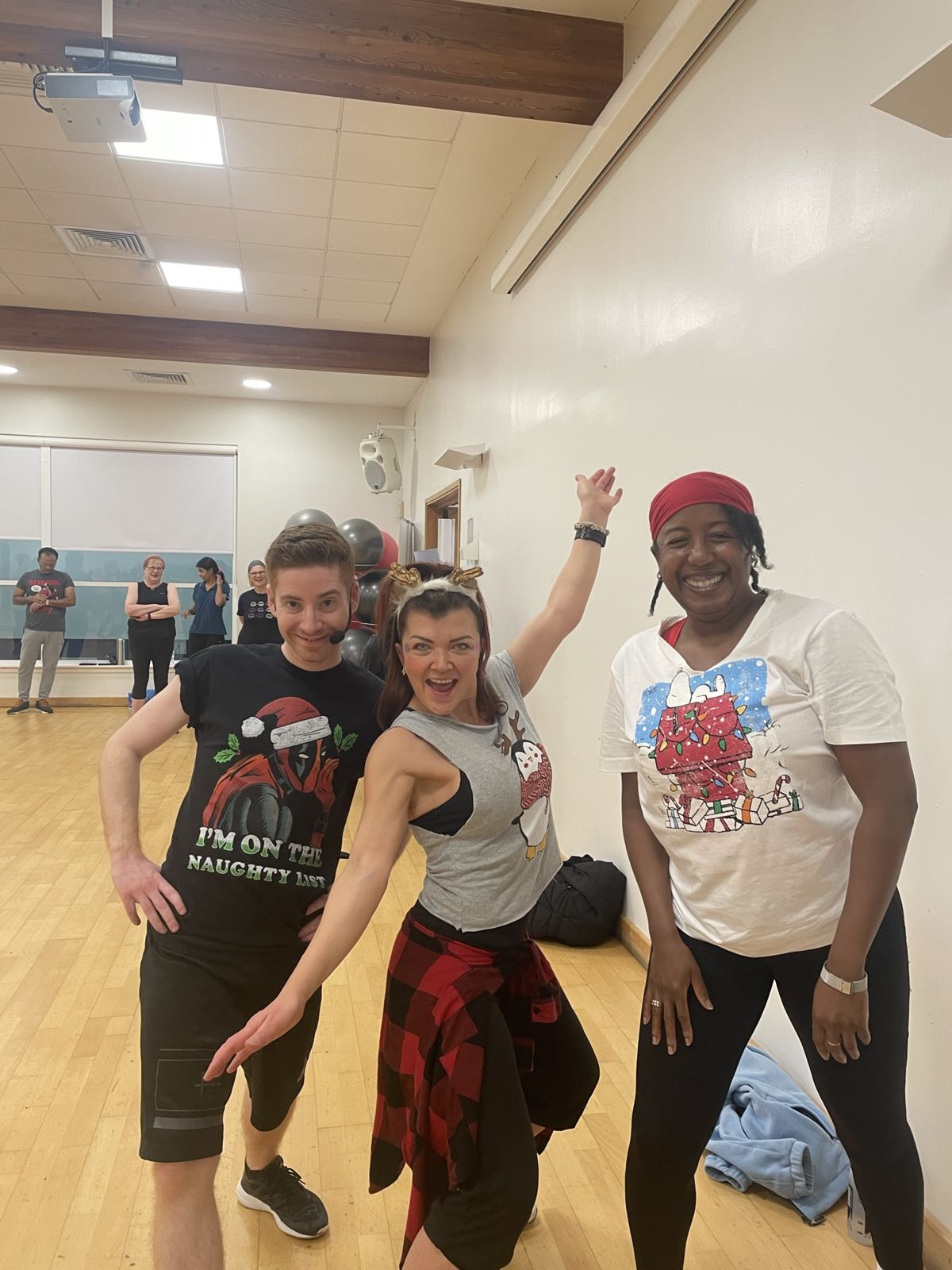 Medina posing with fellow dancers at a festive class